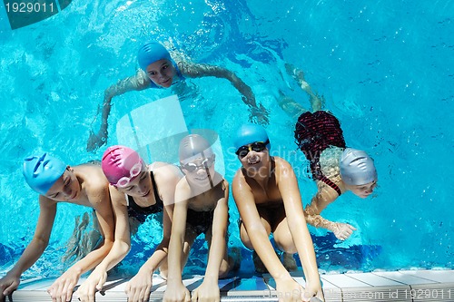 Image of happy children group  at swimming pool