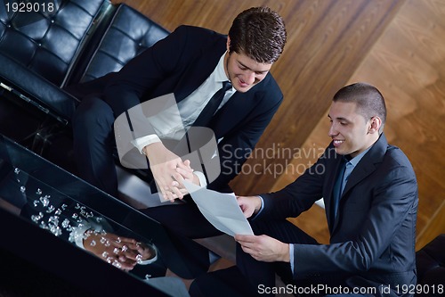 Image of business people making deal