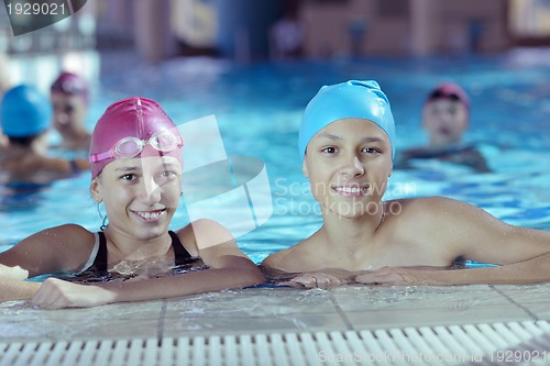 Image of happy children group  at swimming pool