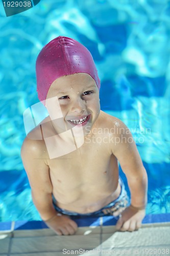 Image of happy child on swimming pool