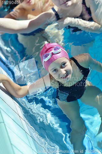 Image of happy children group  at swimming pool