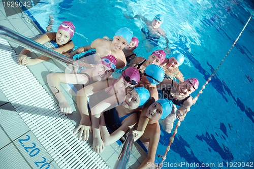 Image of happy children group  at swimming pool