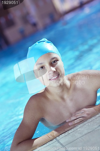 Image of happy child on swimming pool