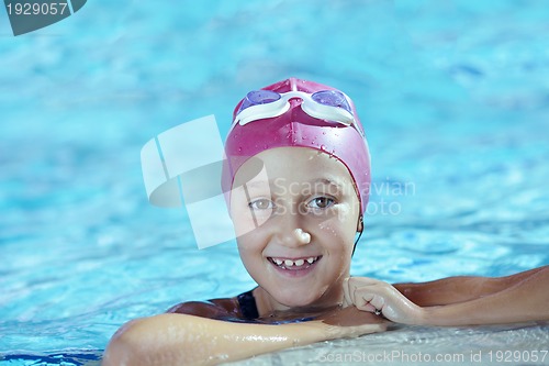 Image of happy child on swimming pool