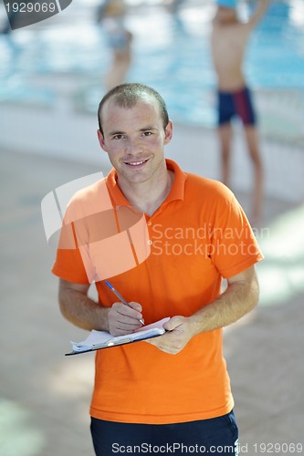 Image of happy children group  at swimming pool