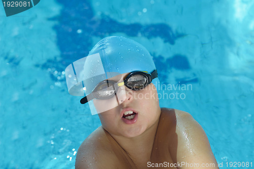Image of happy child on swimming pool