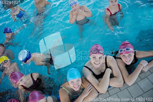 Image of happy children group  at swimming pool