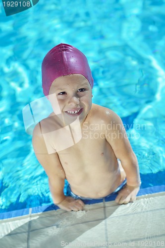 Image of happy child on swimming pool