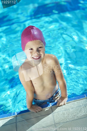 Image of happy child on swimming pool
