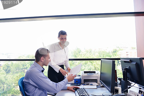Image of business people in a meeting at office