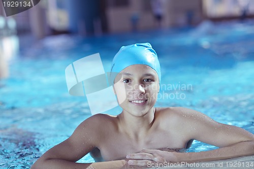 Image of happy child on swimming pool