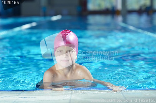 Image of happy child on swimming pool