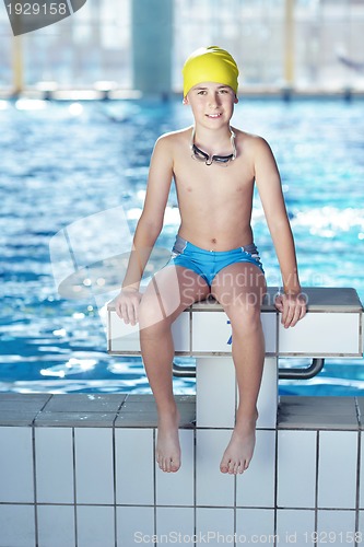 Image of happy child on swimming pool