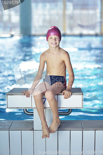 Image of happy child on swimming pool