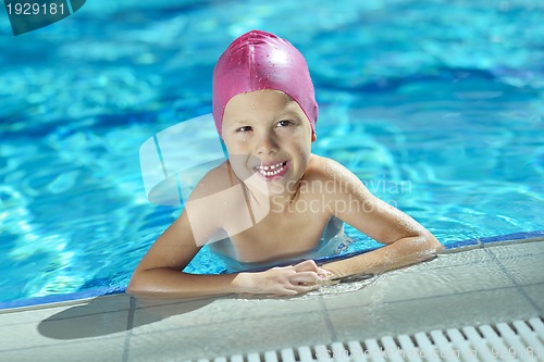 Image of happy child on swimming pool