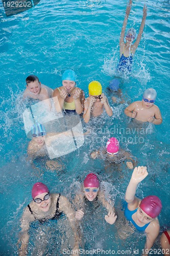 Image of happy children group  at swimming pool