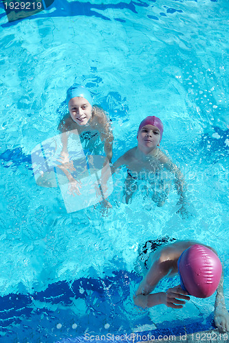 Image of happy children group  at swimming pool