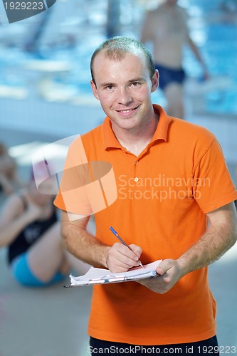Image of happy children group  at swimming pool