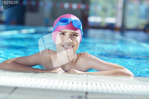 Image of happy child on swimming pool