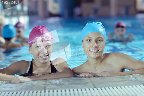Image of happy children group  at swimming pool