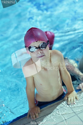 Image of happy children group  at swimming pool