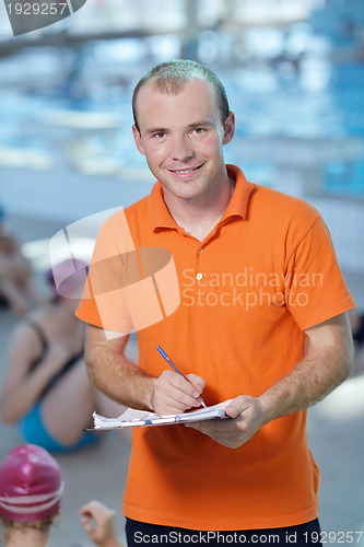 Image of happy children group  at swimming pool