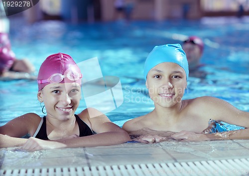 Image of happy children group  at swimming pool