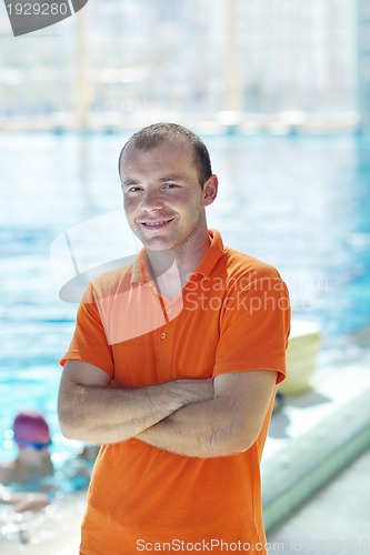 Image of happy children group  at swimming pool