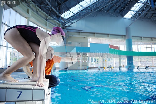 Image of happy children group  at swimming pool