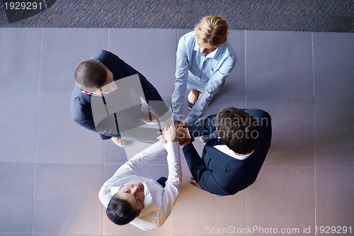 Image of business people group joining hands