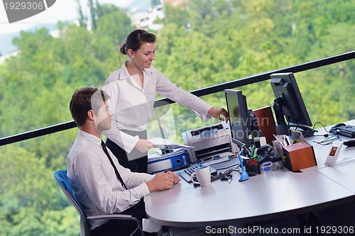 Image of business people in a meeting at office