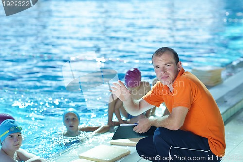 Image of happy children group  at swimming pool