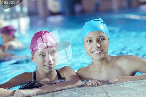Image of happy children group  at swimming pool
