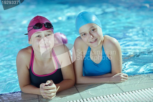 Image of happy children group  at swimming pool