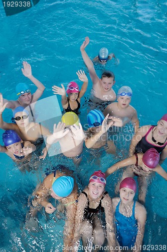Image of happy children group  at swimming pool