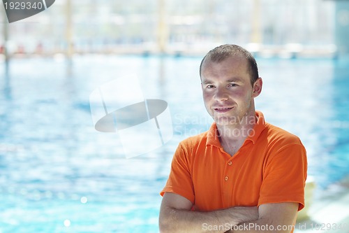 Image of happy children group  at swimming pool