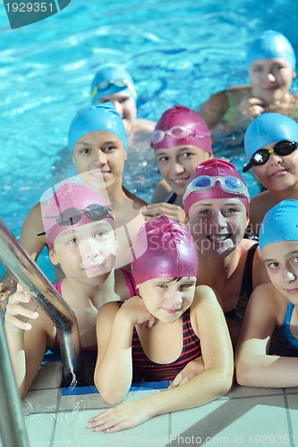 Image of happy children group  at swimming pool