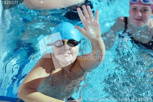 Image of happy children group  at swimming pool