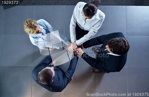 Image of business people group joining hands