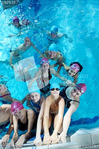 Image of happy children group  at swimming pool