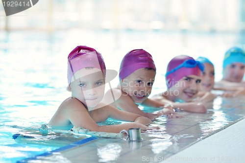 Image of happy children group  at swimming pool