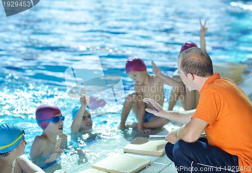 Image of happy children group  at swimming pool