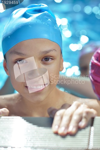 Image of happy child on swimming pool