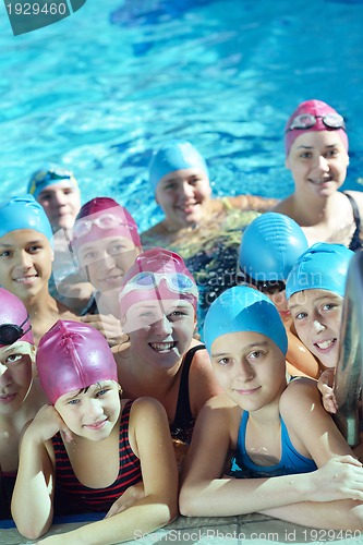 Image of happy children group  at swimming pool