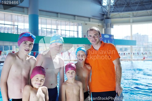 Image of happy children group  at swimming pool
