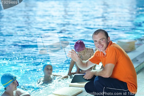 Image of happy children group  at swimming pool