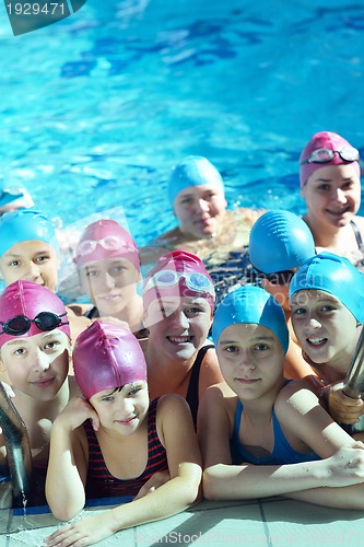 Image of happy children group  at swimming pool