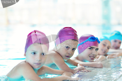 Image of happy children group  at swimming pool