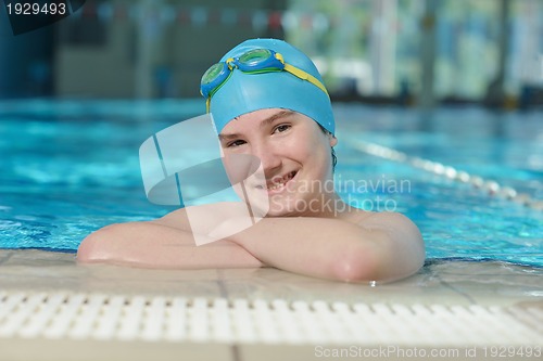 Image of happy child on swimming pool