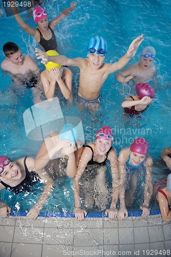 Image of happy children group  at swimming pool